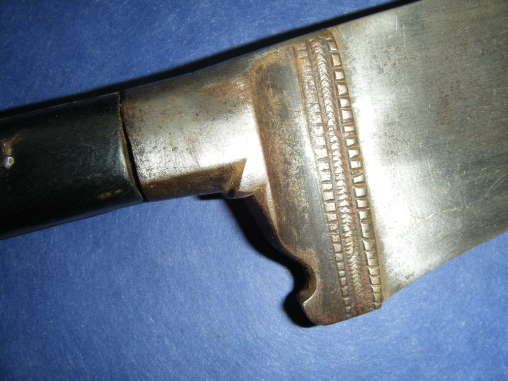 Bhuj, dagger or axe-knife with a hidden Gupti in the handle. Early 18th  Century, made of Damascus steel and blade are damascened in floral design  in gold. Salar Jung Museum, Hyderabad, India. [